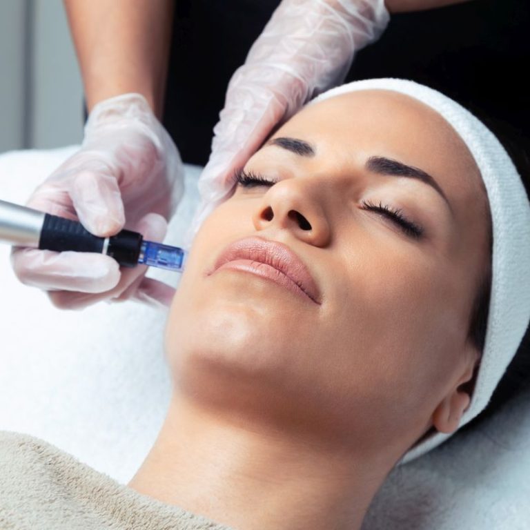 Shot of cosmetologist making mesotherapy injection with dermapen on face for rejuvenation on the spa center.